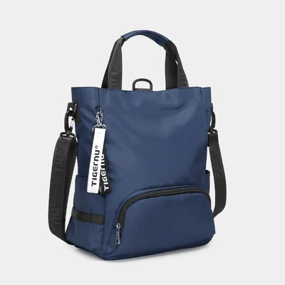 Sac à dos bleu Tigernu en nylon, design moderne, avec poches zippées et bandoulières ajustables, idéal pour le voyage et le quotidien.