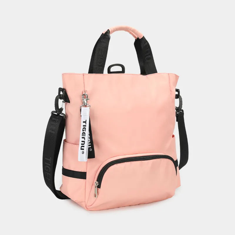 Sac à dos rose multifonction Tigernu avec poignées, bretelles réglables, poche avant zippée et porte-clés. Design moderne et pratique pour femmes.