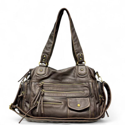 Sac à main en cuir marron avec multiples poches zippées et bandoulière ajustable. Élégant et pratique pour un usage quotidien. Accessoire mode femme.