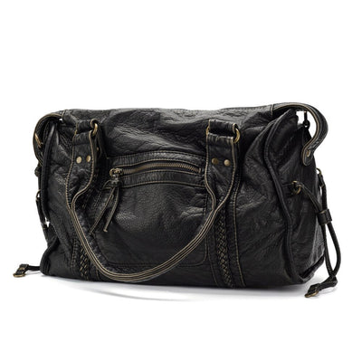 Sac à main en cuir noir texturé avec poches zippées et anses robustes. Élégant et pratique, idéal pour un usage quotidien.