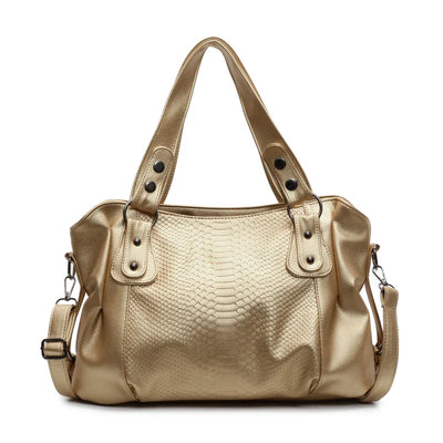 Sac à main en cuir doré avec motif serpent, anses robustes et bandoulière amovible. Élégant et tendance, idéal pour la mode féminine.