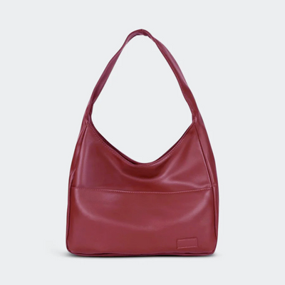 Sac à main en cuir rouge bordeaux, design moderne et minimaliste, avec une anse unique. Accessoire de mode élégant pour femmes.