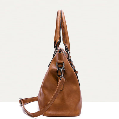 Sac à main en cuir marron avec bandoulière, design élégant et moderne, idéal pour la mode féminine. Accessoire tendance et pratique.