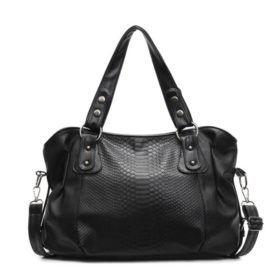 Sac à main noir en cuir texturé, design élégant avec poignées renforcées et bandoulière amovible. Accessoire mode femme chic et tendance.