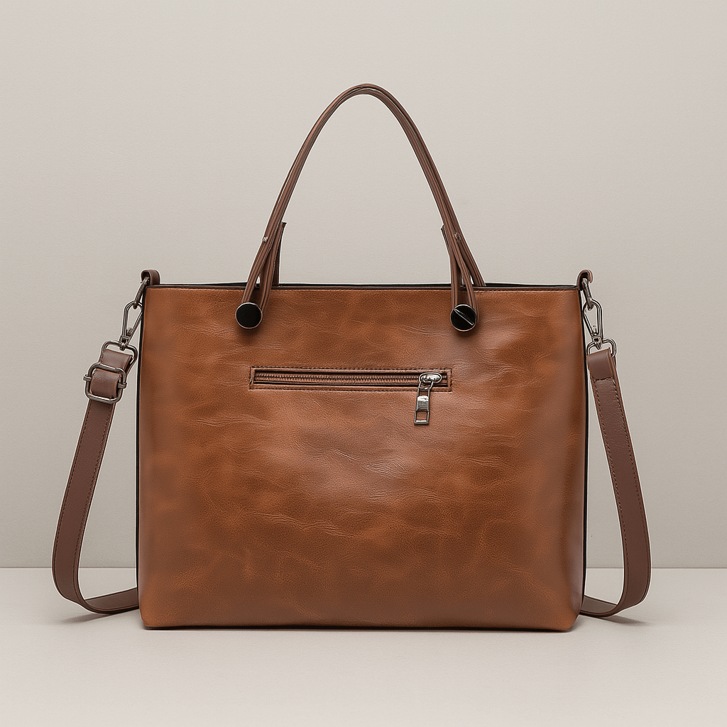 Sac à main en cuir marron avec bandoulière amovible, poche zippée à l'avant, design élégant et moderne, idéal pour femme, mode et accessoires.