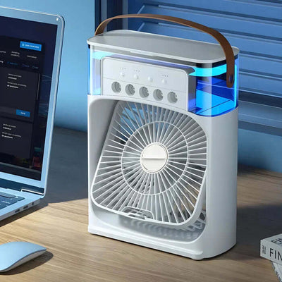 Ventilateur de bureau moderne avec éclairage LED bleu, design compact et poignée en cuir, posé à côté d'un ordinateur portable sur un bureau en bois.