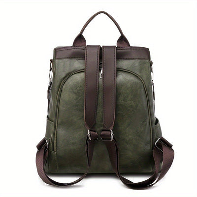 Sac à dos en cuir vert olive avec bretelles marron, design élégant et moderne, idéal pour le voyage ou l'usage quotidien.