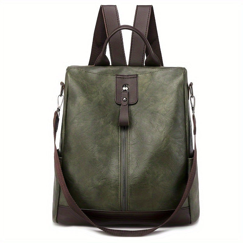 Sac à dos en cuir vert olive avec bretelles marron, fermeture éclair centrale et poignée supérieure. Design élégant et fonctionnel pour femmes.