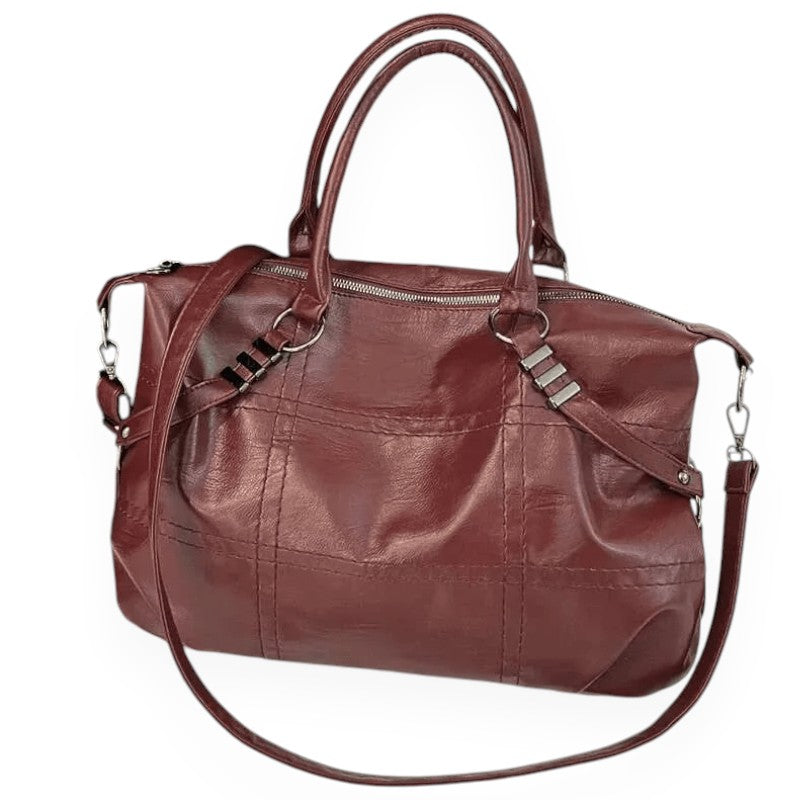 Sac à main en cuir marron avec bandoulière amovible, fermetures éclair argentées et poignées doubles. Accessoire mode élégant et pratique.