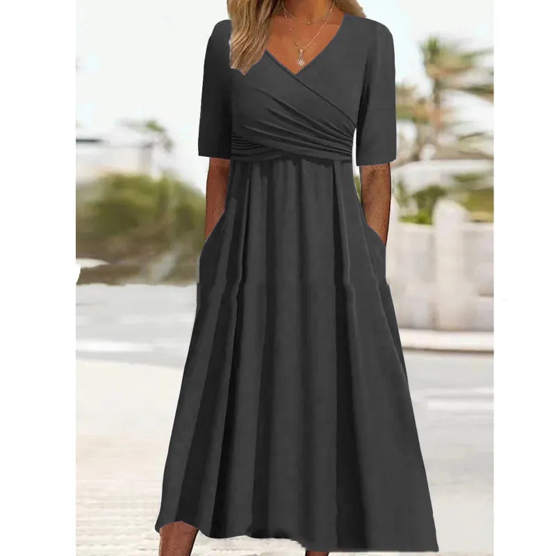 Olivia - robe midi noire simple avec poches latérales