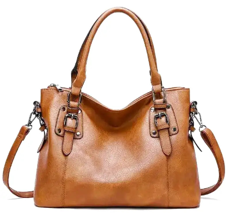 Sac à main en cuir marron élégant avec bandoulière amovible, boucles décoratives et design moderne. Accessoire mode femme chic et pratique.