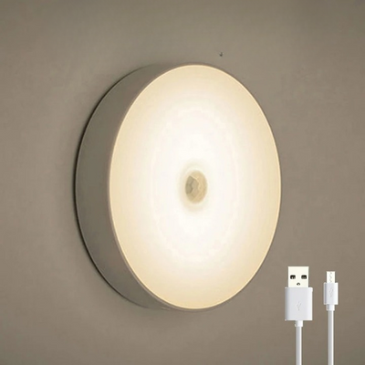 Lampe murale LED ronde avec capteur de mouvement, lumière blanche chaude, câble USB inclus, éclairage intérieur moderne, économie d'énergie.