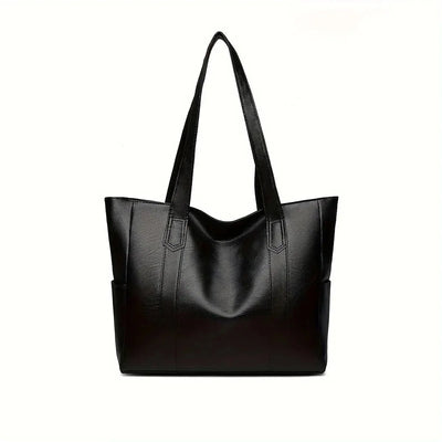 Sac à main en cuir noir élégant avec anses longues, design moderne et spacieux. Accessoire mode femme, idéal pour le quotidien et les sorties.