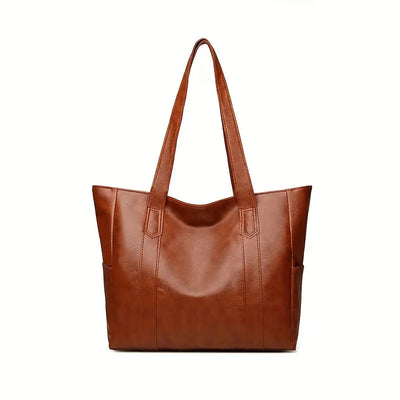 Sac à main en cuir marron, design élégant et spacieux, idéal pour le quotidien. Accessoire mode femme, tendance et pratique.