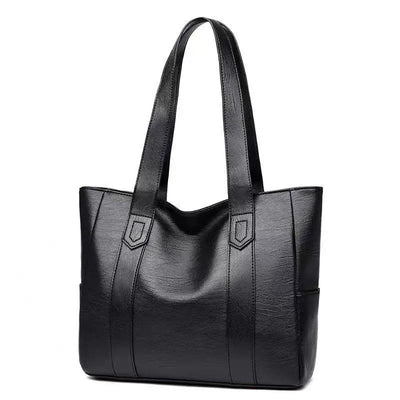 Sac à main en cuir noir élégant avec anses longues, design moderne et spacieux, parfait pour le quotidien ou le bureau. Accessoire mode femme.