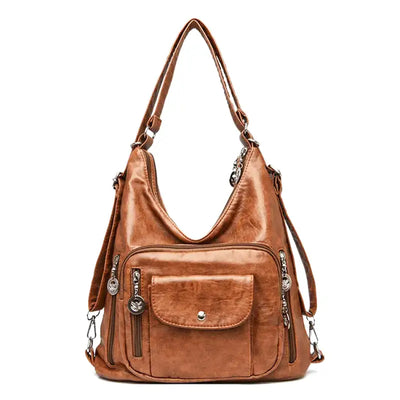 Sac à main en cuir marron avec multiples poches zippées et bandoulière ajustable, design élégant et pratique pour femme, mode tendance.