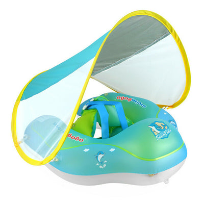 Bouée bébé verte avec auvent amovible, motifs dauphin, ceinture de sécurité intégrée. Accessoire piscine enfant, protection solaire.