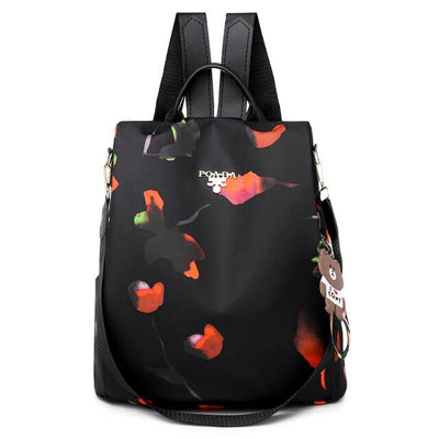 Sac à dos noir élégant avec motifs floraux colorés, bretelles ajustables et porte-clés ours. Idéal pour la mode urbaine et le quotidien.
