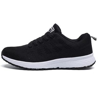 Chaussure de sport noire unisexe avec semelle blanche, design respirant en maille, idéale pour la course et le fitness.