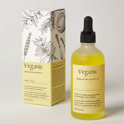 Flacon d'huile de croissance capillaire Veganic avec boîte illustrée. Ingrédients naturels: café vert, argan, noix de coco, romarin. 100% naturel.