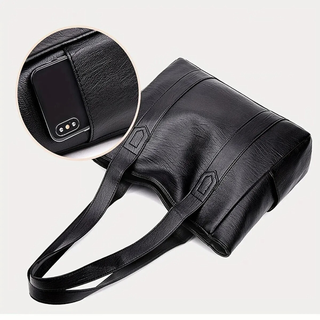 Sac à main en cuir noir élégant avec compartiment pour smartphone, design moderne et pratique, idéal pour femmes actives et tendance.